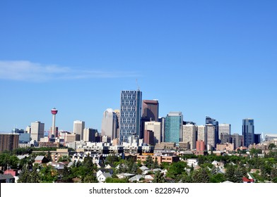 Calgary skyline with urban residential community in foreground.