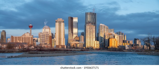 Calgary's skyline in the early morning along the Bow River. Facing West. 