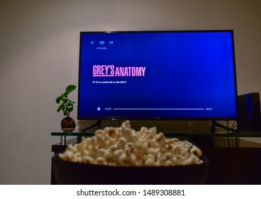 Cali, Colombia - August 26, 2019: Netflix App On Tv Screen Playing The Grey's Anatomy Serie Behind A Bowl Of Popcorns.