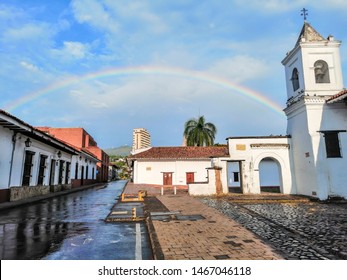 Cali, Colombia - July 14, 2019: A beautiful rainbow and the beautiful church La Merced, icon of the city.