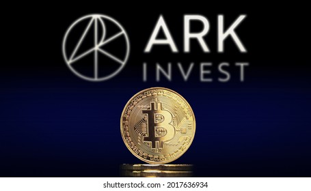 Cali, Colombia - July 20, 2021: Bitcoin BTC Representation Coin With ARK Invest Logo In Background.