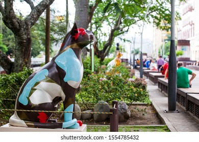 CALI, COLOMBIA - OCTOBER, 2019: One of the group of statues of cats located at the River Boulevard in Cali