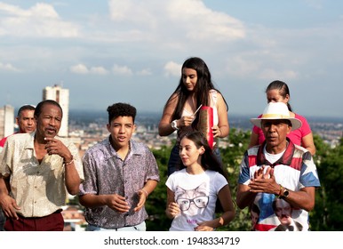 CALI,COLOMBIA - DECEMBER 12 OF 2019 : Group of salsa dancing and singing in San Antonio main square