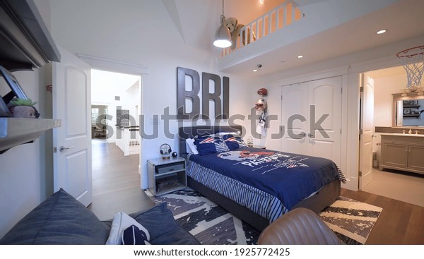 California, 27 February 2021: Luxurious Bright\
Bedroom With Comfortable King Size Bed and Modern Furniture.\
Template For Expensive Residential Mansion. Concept For Interior,\
Architecture And\
Lifestyle