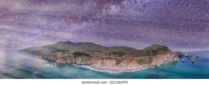 California Coastline Panoramic View From Drone. Bixby Bridge Along The Big Sur On A Starry Night, USA.