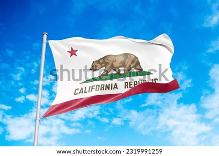 California flag waving in the wind, blue sky background