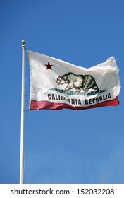 California Republic Flag On A Pole. Clear Blue Sky In A Background. California Photo Collection.