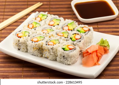 California roll maki sushi on a white plate.