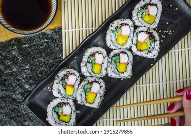 California roll on beautiful decorated plate