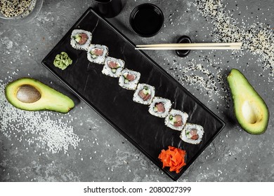 California Roll Sushi Traditional Japanese Rice Food With Salmon, Avocado, Cucumber, Nori And Sesame Seeds.