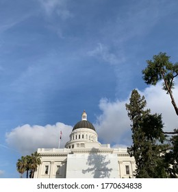 California State Capitol Museum, Sacramento. The Sky Is Mostly Clear But Contains A Little Bit Clouds Which Is Almost The Same Color As The Building.