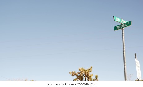 California Street Crossroad Sign, Road Intersection USA. Travel Destination For Road Trip On Vacations. Joshua Tree National Park, Desert Wilderness. Countryside Hitchhiking Trip. Arid Climate.