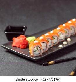 California Unagi Sushi Roll with soya, wasabi, ginger and black chopstick