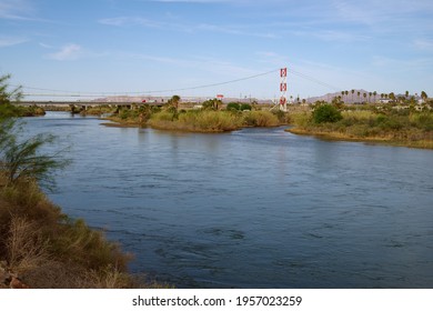 California, USA - April 15, 2021: image of the Colorado River at the California-Arizona border. The interstate highway 10 is in the background.