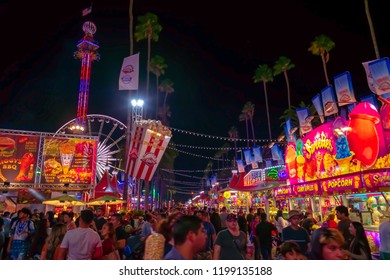 California, USA - September 23rd, 2018. Many People Come To LA County Fair That Takes Place In Pomona, CA. The Street Is Filled With Crowd Of People Who Are Enjoying, Walking And Eating On Night .