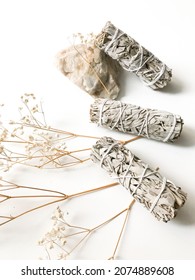 california white sage, beautiful layout and top view, incense and dried flowers on a white background