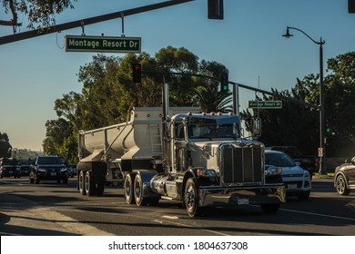 California, Year 2017: Front View Of A Big Truck Driving On Route In The West Coast.