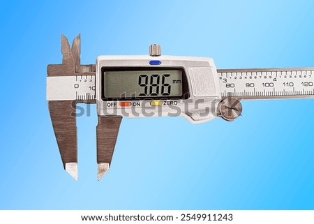 caliper. a device for measuring precision. the size of a part, as well as the diameter. close-up.