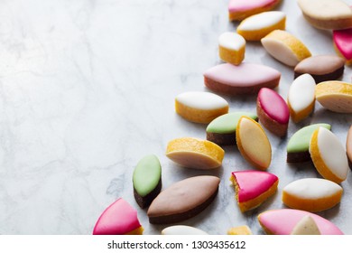 Calissons assortment on marble background. Traditional French Provence sweets. Copy space.