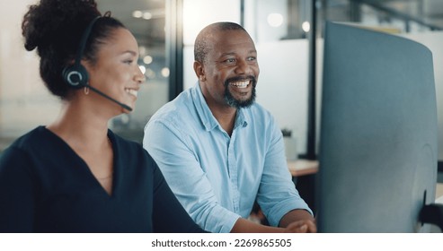 Call center, black man and training woman, telemarketing intern and crm customer service consultant on computer software in office agency. Business people, sales mentor and coaching for tech solution - Powered by Shutterstock