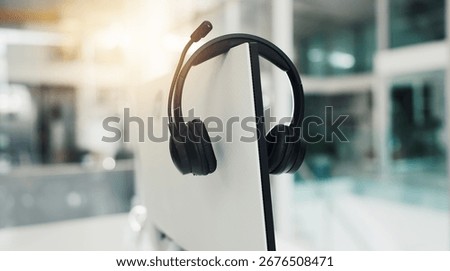 Call center, computer and mic with headset in empty office for virtual assistance, crm and help desk. Communication, contact us and hotline support with headphones for lead generation and flare
