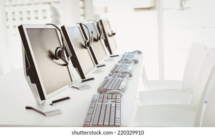 Call Center Computers And Headsets All In A Row