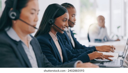 Call center, customer service and an indian woman with a headset in her office for help or assistance. Customer support, contact us or question with a young employee working on a laptop at her desk - Powered by Shutterstock