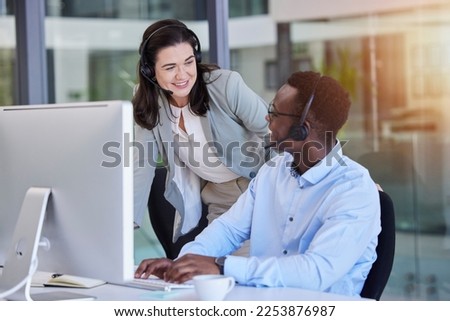 Call center, customer service and a manager talking to a black man consultant in their telemarketing office. Ecommerce, contact us and training with a female supervisor coaching a male sales employee