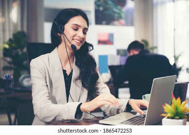 Call Center And Customer Service Team Support For Information Operator At Work.  People Woman Employee Consultant And Talking On Hands Free Phone For Help And Service Customer.