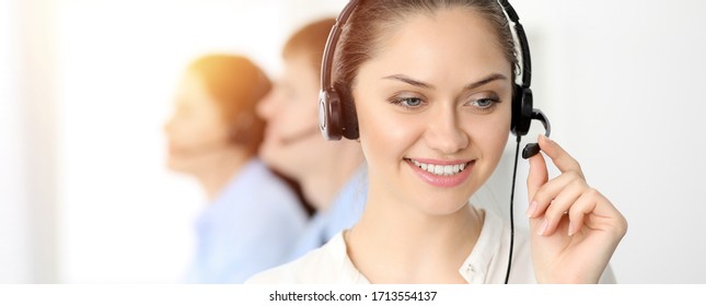 Call Center. Diverse Customer Service Operators In Headsets At Work In Office. Business Concept