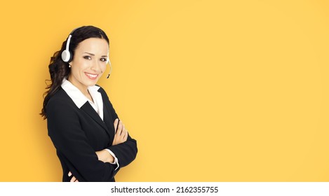 Call center help line service. Portrait photo customer support phone sales agent operator in headset, yellow color background. Happy smiling confident business woman crossed arms. Caller worker. Zoom