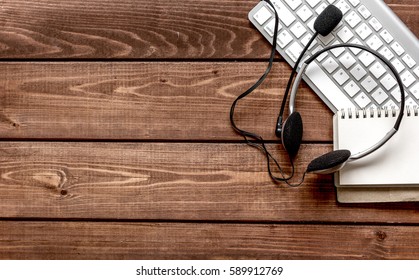 Call Center Manager Desktop Top View Wooden Background