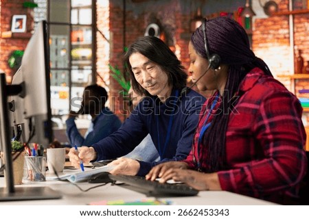 Call center managers developing strategies to improve customer loyalty, looking over paperwork. Customer support management team implementing procedures for better client issue resolution