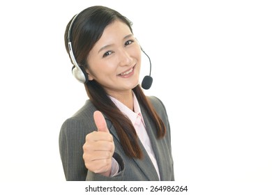 Call center operator showing thumbs up sign - Powered by Shutterstock