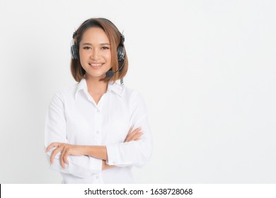 Call Center Operator Woman Short Hair, Wearing A White Shirt With Headset Standing Crossing Her Arms Isolated On White Background.