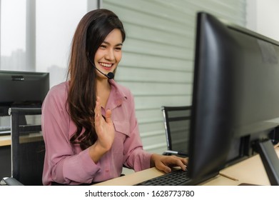 Call Center Operators. Beautiful Asian Woman Working Service Consulting Clients With Headset And Computer In Workplace Service Center.