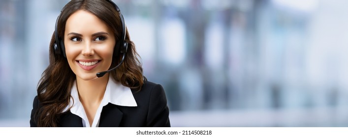 Call center. Portrait of looking aside customer support advertiser sales operator in headset. Businesswoman or phone worker, inside. Answering service centre agent, blurred modern office background. - Shutterstock ID 2114508218