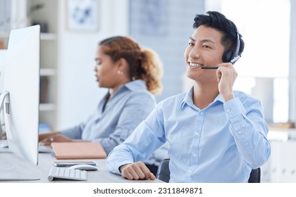 Call center, smile and asian man in office for customer support, advice and friendly service. happy, telemarketing and male consultant online for help, support or crm, faq or contact us communication - Powered by Shutterstock