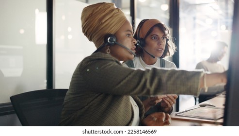 Call center, training and black woman coaching recruit at customer service agency in Africa. Diversity, teamwork and crm, telemarketing manager consulting woman at desk for customer support help line - Powered by Shutterstock