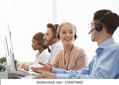 Call Centre And Customer Service Concept. Tech Support Operators Discussing Something At Workplace