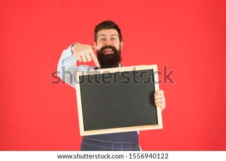 Call for delivery. mature man red background. happy hipster bartender. Restaurant menu. cafe shop advertisement. Happy hours. bearded man show chalkboard, copy space. brutal waiter in kitchen.