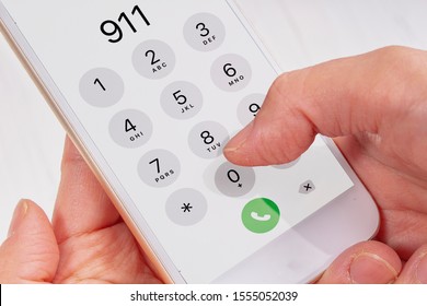 Call emergency 911 hands holding a phone - Powered by Shutterstock