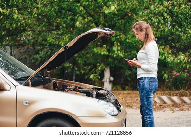 Call The Help Of An Auto Repair Service By Phone. The Girl Is Waiting For The Tow Truck. The Girl Is Upset By The Car Breakdown.