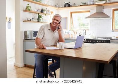 Call, Laptop And Finance With A Senior Man Using A Phone While Planning Finance, Savings And Investment For Retirement. Computer, Money And Communication With An Elderly Male Pensioner In The Kitchen