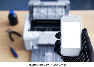 Call To Printer Repair Service Mockup. Blank Screen Mobile Phone And Broken Printer On The Table.