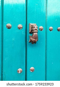 Caller With Fatima Hand On Aquamarine Door Of Stately Town House Seville Andalusia Spain 06/15/2020