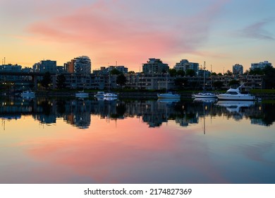 Calm Anchorage Summer Dawn Vancouver. False Creek at sunrise in Vancouver. British Columbia, Canada.

                               