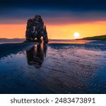 Calm Atlantic seascape. Huge basalt stack Hvitserkur on the eastern shore of the Vatnsnes peninsula. Unbelievable summer sunrise in northwest Iceland, Europe. Beauty of nature concept background.