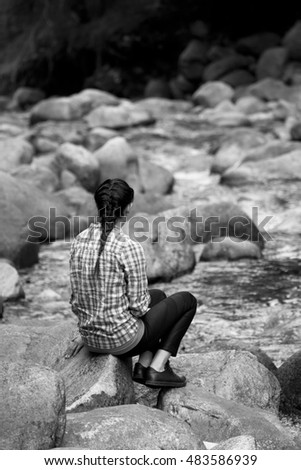 Similar – beautiful brunette short hair girl leaning on gray rock wall outdoors smiling happy