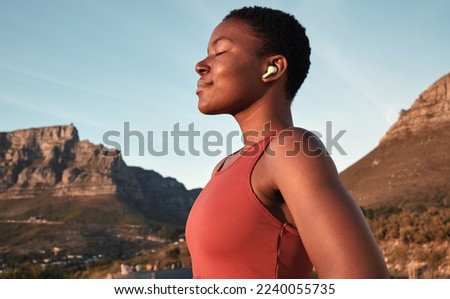 Calm black woman, outdoor fitness and breathing in nature, Cape Town mountains and meditation of motivation, health or relax mindset. Female athlete, breathe and workout peace for zen sports wellness